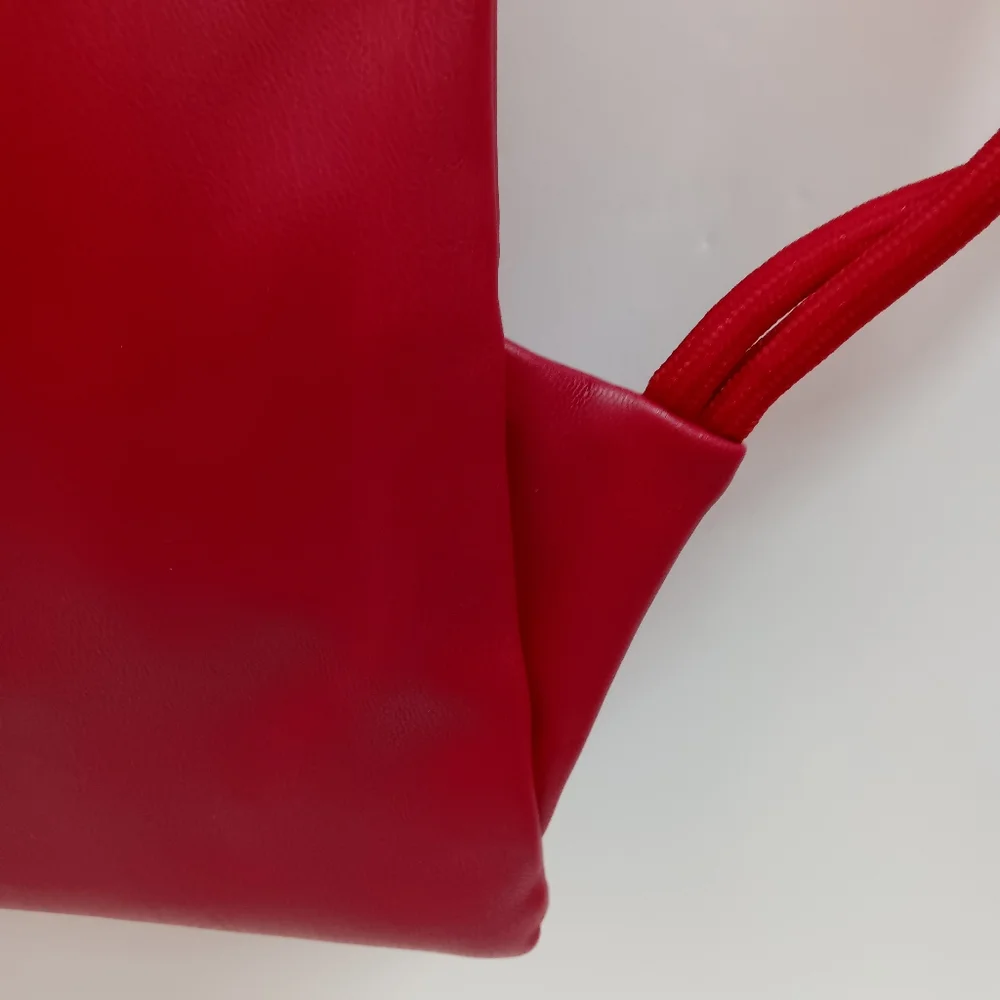 JORDAN Red Faux Leather Drawstring Backpack with Gold Jumpman